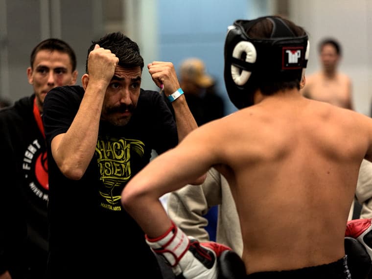A PBSC affiliate coach working through guard with an athlete